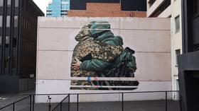 Aussie artist pressured to paint over peace mural