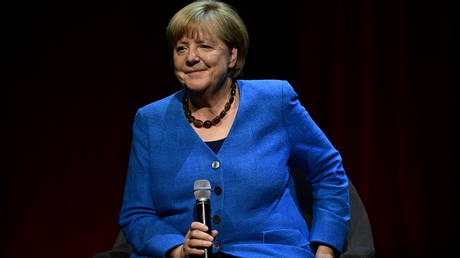 Former German Chancellor Angela Merkel speaking on stage at the Berliner Ensemble theatre in Berlin on June 7, 2022.