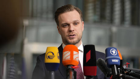 Gabrielius Landsbergis speaks with the media as he arrives for a meeting of NATO foreign ministers at NATO headquarters in Brussels, Belgium, April 6, 2022