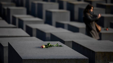 Roses are placed Berlin’s Memorial to the Murdered Jews of Europe in recognition of International Holocaust Remembrance Day in January 2021.