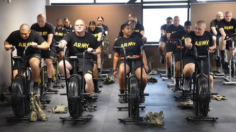 US Army recruits are shown participating in a new training program for those who don't yet qualify for service because of weight or academic standards