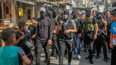 Palestinian gunmen from the Balata refugee camp battalions emanating from the Fatah movement after a press conference after an Israeli army raid in which a 25-year-old Palestinian was killed and another was arrested, in Balata refugee camp, east of Nablus in the West Bank.