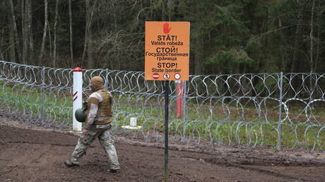 FILE PHOTO. "Stop - state border" is written in three languages on the border between Latvia and Belarus.