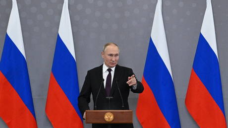 Russian President Vladimir Putin talks to journalists in Astana, Kazakhstan, on October 14, 2022.