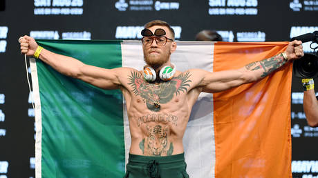 UFC former lightweight champion Conor McGregor holds an Irish flag