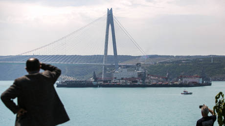 The vessel Pioneering Spirit with parts of the offshore section of the TurkStream pipeline on board passes the Yavuz Sultan Selim Bridge on the Bosphorus Strait in Istanbul on May 31, 2017.