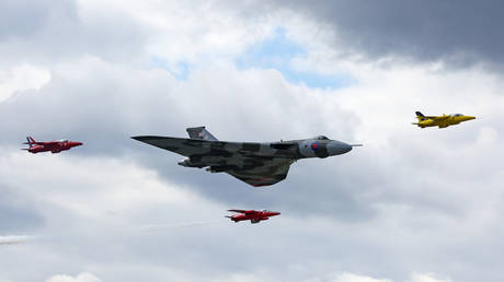 FILE PHOTO. Avro Vulcan XH558 flies in formation with Gnat display team in 2014.