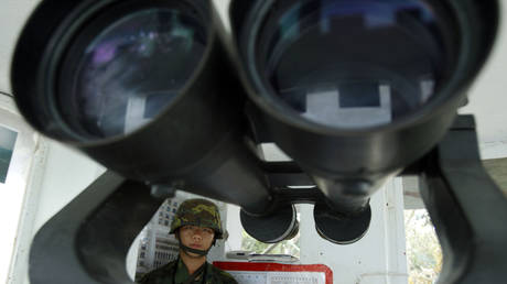 FILE PHOTO: A Taiwanese soldier stands in a frontline military installation just 1.8 kilometers (0.7 miles) off the coast of China, on Kinmen island, Taiwan.