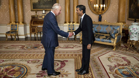 King Charles III welcomes Rishi Sunak during an audience at Buckingham Palace, London, where he invited the newly elected leader of the Conservative Party to become prime minister and form a new government, Tuesday, Oct. 25, 2022.