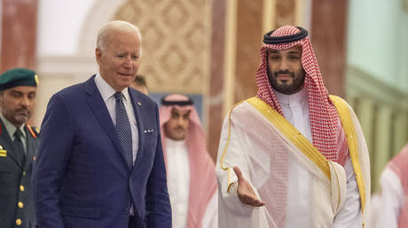 FILE PHOTO: US President Joe Biden (L) being welcomed by Saudi Arabian Crown Prince Mohammed bin Salman (R) at Alsalam Royal Palace in Jeddah, Saudi Arabia.