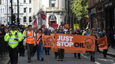 Climate activists march through London and occupy Waterloo Bridge on October 2nd 2022, Central London, United Kingdom.