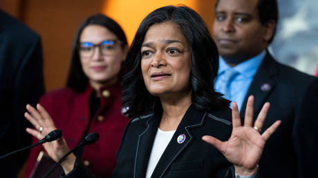 FILE PHOTO. From left, Reps. Alexandria Ocasio-Cortez, D-N.Y., Pramila Jayapal, D-Wash., and Joe Neguse, D-Colo., conduct a news conference in the Capitol Visitor Center on banning members of Congress from trading stocks.