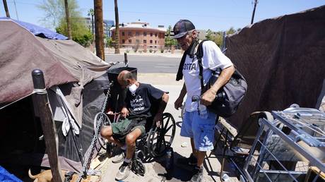 Woman arrested for feeding homeless sues city