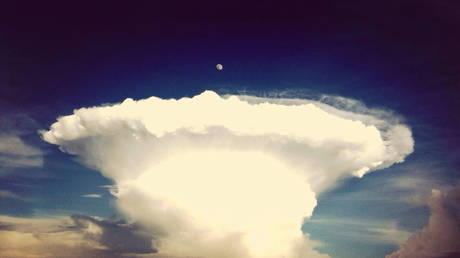 FILE PHOTO. Atomic Explosion Against Blue Sky At Dusk