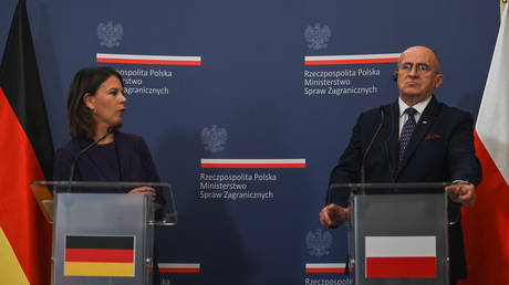 Annalena Baerbock and Zbigniew Rau, German and Polish ministers of foreign affairs, meet in Warsaw to discuss reparations and other matters.