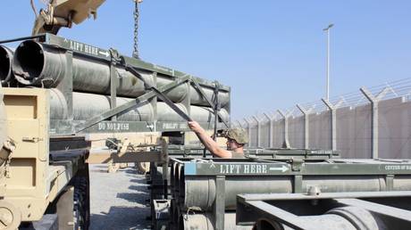 FILE PHOTO: HIMARS artillery pods being loaded onto a truck