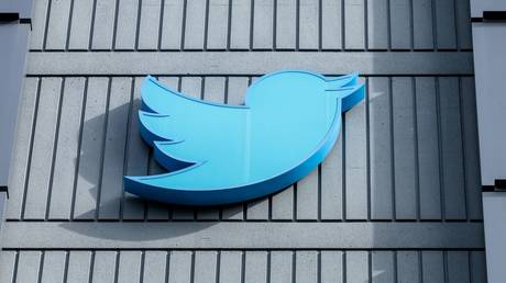 The Twitter logo is seen on a sign on the exterior of Twitter headquarters in San Francisco.
