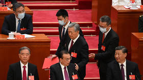 Former Chinese leader abruptly exits key assembly