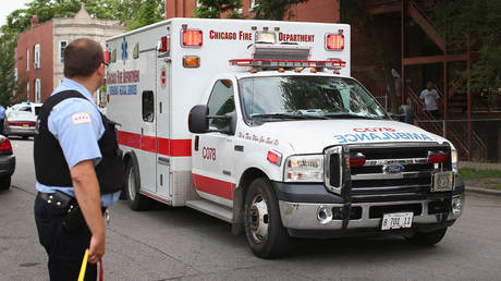 FILE PHOTO: An ambulance leaves a crime scene in Chicago.