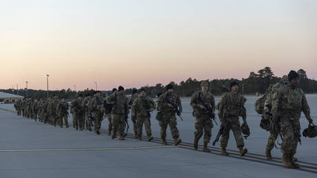 FILE PHOTO: Members of the 82nd Airborne Division of the US Army prepare for deployment to Poland from Fort Bragg, North Carolina, February 14, 2022