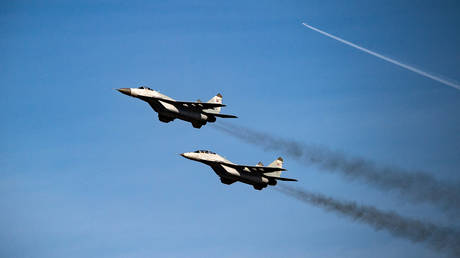 FILE PHOTO: Serbian Air Force Mig 29 fighter planes fly over the Batajnica military airport near capital Belgrade.