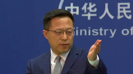 FILE PHOTO: Chinese Foreign Ministry spokesperson Zhao Lijian gestures during a media briefing in Beijing, China.