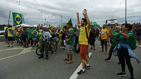 FILE PHOTO. Supporters of President Jair Bolsonaro block a highway to protest the results of the presidential run-off.