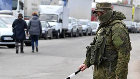 FILE PHOTO. Vehicles seen queuing amid evacuation of civilians from Kherson, Russia.