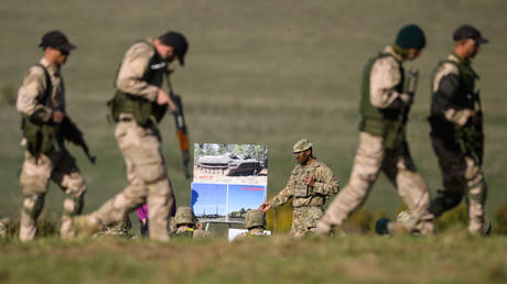 Ukrainian military recruits are shown being trained by UK forces last month in southern England.