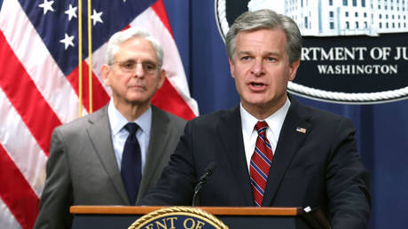 FBI director Christopher Wray (right) and US Attorney General Merrick Garland are shown at a press briefing last month in Washington.