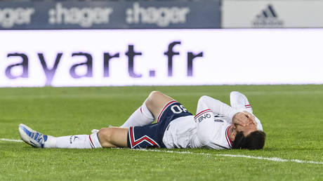 Lionel Messi lies injured during the Ligue 1 match between RC Strasbourg and Paris Saint-Germain at Stade de la Meinau on April 29, 2022