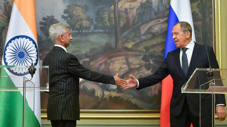 Russian Foreign Minister Sergey Lavrov, right, and his Indian counterpart Subrahmanyam Jaishankar shake hands during a news conference following their meeting in Moscow, Russia.