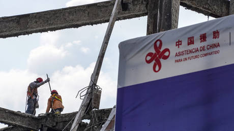 FILE PHOTO: Workers perform construction labour during the demolition of the Salvadoran National Lirary to build new one in San Salvador, El Salvador.