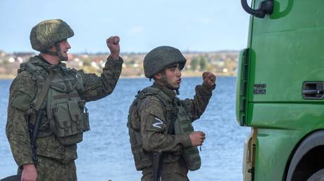 FILE PHOTO: Russian soldiers are seen at a Dnieper River crossing in the city of Kherson on November 2, 2022.