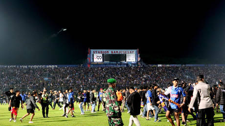 Thousands march and demand justice over Indonesia soccer stadium tragedy