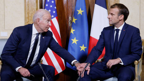 FILE PHOTO. French President Emmanuel Macron (R) and US President Joe Biden (L) meet at the French Embassy to the Vatican in Rome.