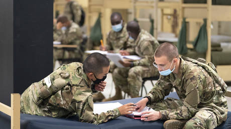 FILE PHOTO: Students enlisted in a US Army prep course work together in barracks at Fort Jackson in Columbia, South Carolina, August 26, 2022