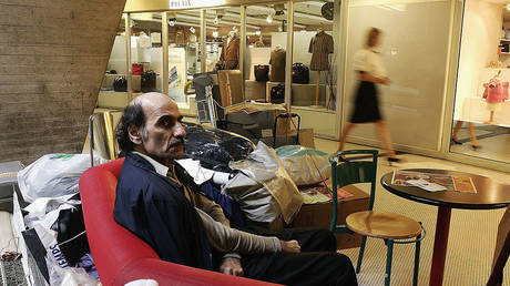 Mehran Karimi Nasseri is shown sitting at Terminal 1 of Paris Charles de Gaulle Airport in August 2004.