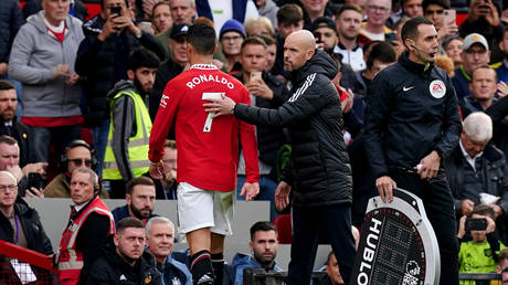 Manchester United's Cristiano Ronaldo with manager Erik ten Hag after being substituted during a Premier League match at Old Trafford