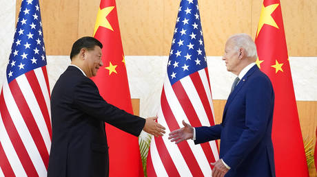US President Joe Biden shakes hands with Chinese President Xi Jinping before their meeting on the sidelines of the G20 summit meeting, November 14, 2022