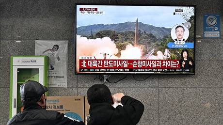 FILE PHOTO: Residents of the South Korean island of Ulleungdo watch file footage of a North Korean missile test.
