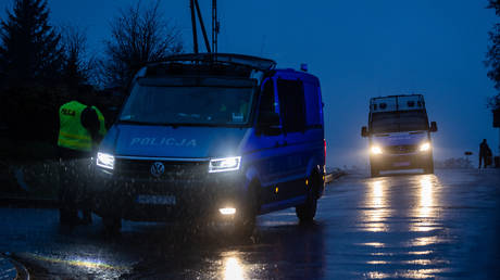 Police block a road on November 16, 2022 near the site where a missile strike killed two men in the eastern Poland village of Przewodow.