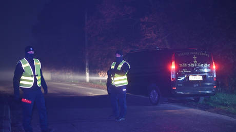 Police officers secure access to the site of the explosion in the village of Przewodow in the Lublin Voivodeship, on November 16, 2022 in Przewodow, Poland.