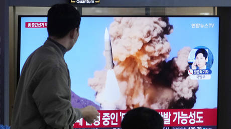 FILE PHOTO: A TV news program shows an image of a North Korean missile launch at the Seoul Railway Station in Seoul, South Korea, November 9, 2022.