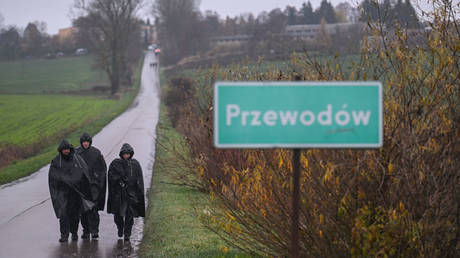 Police officers patrol around the blast site in Przewodow, Poland, November 16, 2022.