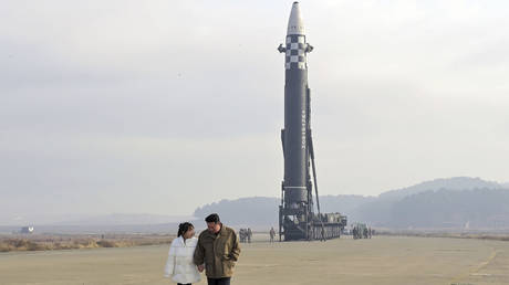 North Korean leader Kim Jong-un and his daughter are shown inspecting the site of a missile launch on Friday at Pyongyang International Airport.