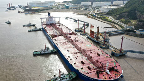FILE PHOTO: Oil tanker at a port terminal operated by China Petrochemical Corporation (Sinopec Group) in Zhoushan, Zhejiang Province, China, November 4, 2020.