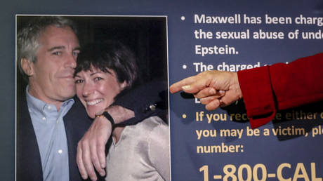 FILE PHOTO: Audrey Strauss, acting US attorney for the Southern District of New York, points to a photo of Jeffrey Epstein and Ghislaine Maxwell during a news conference in New York, July 2, 2020