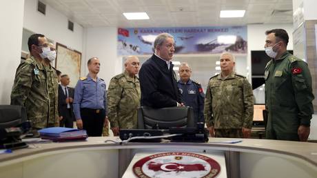 Turkish Defense Minister Hulusi Akar gets briefed on the military operation in Syria, November 21, 2022