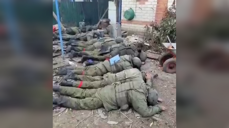 A screenshot from a video showing Russian soldiers surrendering to the Ukrainian forces
